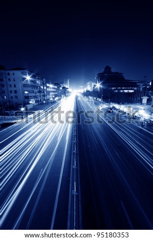 light trails on the modern street at night in beijing financial center,China.