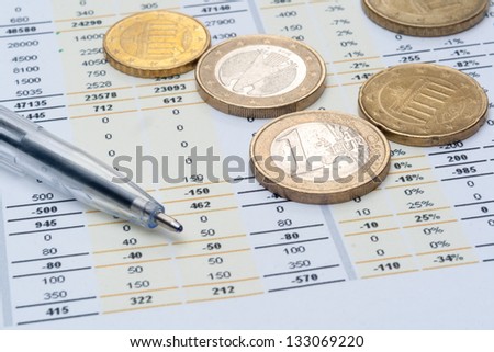 Business background, market analysis concept with financial data, pen and euro coins