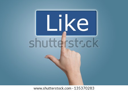 Hand pressing Like button on blue background