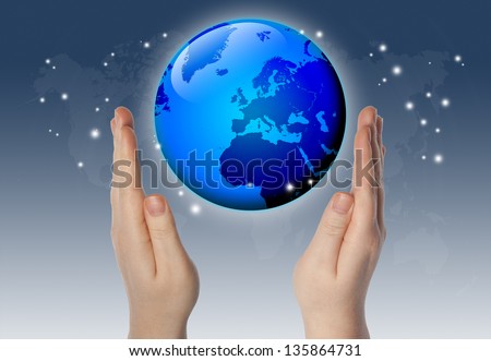 world or globe in your hands on blue background