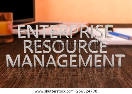 Enterprise Resource Management - letters on wooden desk with laptop computer and a notebook. 3d render illustration.