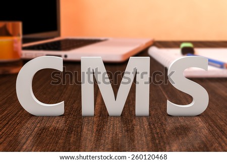 CMS - Content Management System - letters on wooden desk with laptop computer and a notebook. 3d render illustration.