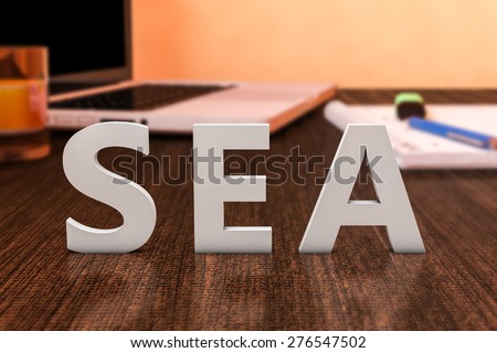 SEA - Search Engine Advertising - letters on wooden desk with laptop computer and a notebook. 3d render illustration.