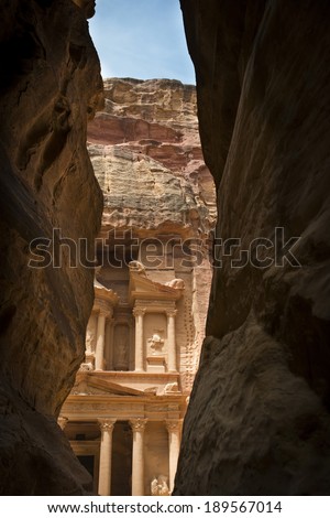 Ancient ruins of Petra Jordan. Narrow gorge to ancient city Petra, Jordan. The city of Petra was lost for over 1000 years but is now one of the new Seven Wonders of the World.
