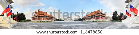 panoramic night shot of chiang kai shek memorial hall with National Theater Hall at right and National Theater Hall at right, with flags by the main gate,Taipei, Taiwan