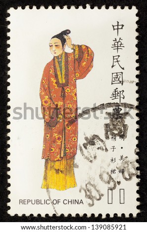 TAIWAN -CIRCA 1997: A stamp printed in Taiwan shows traditional chinese painting of a beautiful lady wearing a traditional Chinese Costume, circa 1997