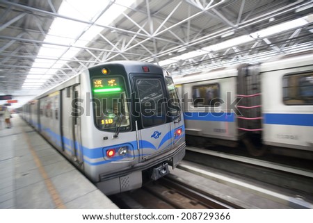 TAIPEI, TAIWAN - JUNE 20: Fast moving MRT leaving the platform on June 20, 2014 in Taipei. The MRT Subway is one of the best way to go ground Taipei city and new line is still under construction