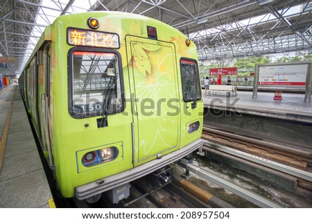 TAIPEI, TAIWAN - JUNE 20: Fast moving MRT on the platform on June 20, 2014 in Taipei. The MRT Subway is one of the best way to go ground Taipei city and new line is still under construction