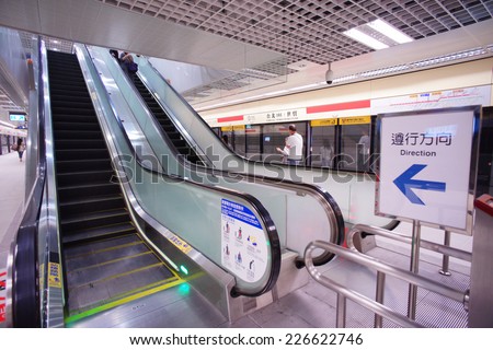 TAIPEI,TAIWAN - JANUARY 26: a escalator to get down the platform of the MRT, on January 26,2014 in Taipei. The MRT serves 240,000 people daily and it is one of the best way to travel around the city