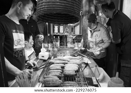 Kaohsiung, Taiwan - NOVEMBER 9, 2014: Street food market in Kaohsiung night market.  People enjoy food at night market in taiwan.  And is one of the unique culture in Taiwan.  November 9, 2014