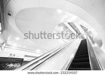TAIPEI,TAIWAN - NOVEMBER 21: a escalator to get down the platform of the MRT, on November 21, 2014 in Taipei. The MRT serves 240,000 people daily and is one of the best way to travel around the city
