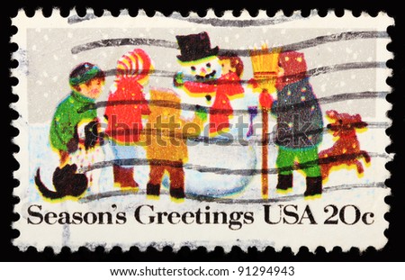 USA - CIRCA 1982: A stamp printed in USA shows a picture of children decorating a snowman with dogs around, circa 1982