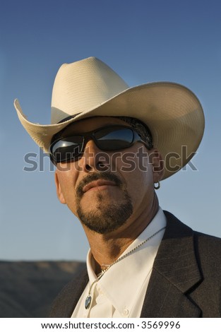 Head shot of Hispanic male with cowboy hat