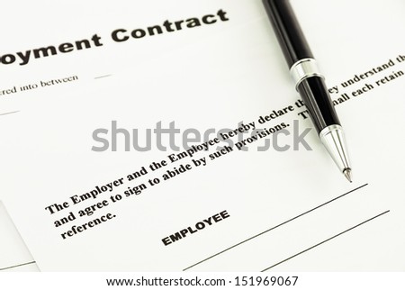 Employment contract and pen ready to sign it