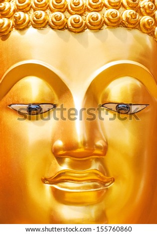 Buddha gold face close-up