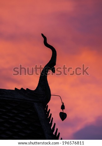 Silhouette, Gable apex on the roof of  temple thailand in sunset