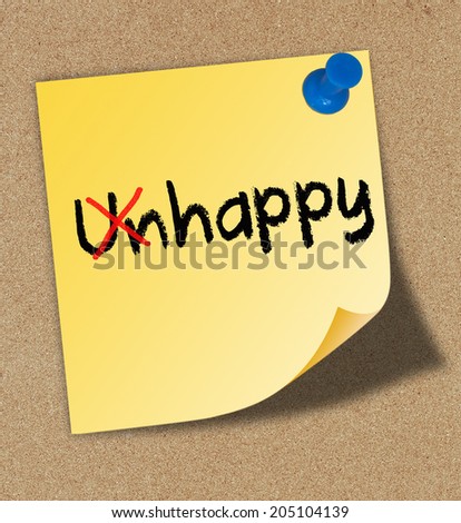 Unhappy into Happy with red marker written on yellow note pinned on cork board.