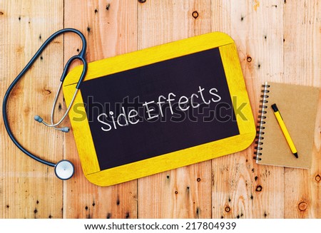 Word Side Effects written on blackboard and stethoscope