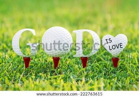 GOD IS LOVE, Golf letters word on green grass.
