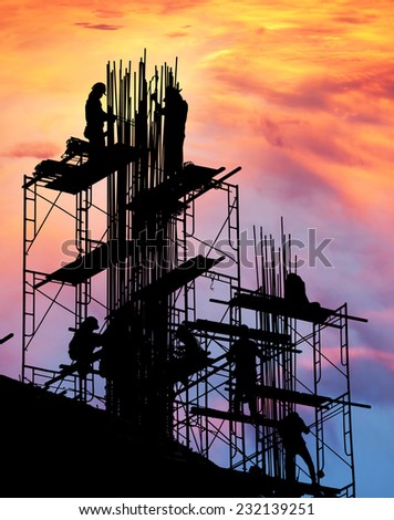 Builder silhouette of construction worker on scaffold