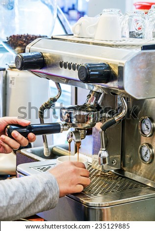 Coffee machine making espresso in a coffee shop.