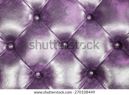 Dark purple leather upholstery sofa background for decoration.