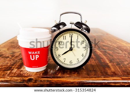 Alarm clock and coffee cup, Eight o\'clock in the morning.