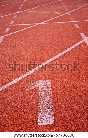 Number one on the start of a running track.