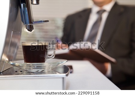 Businessman decided to use coffee without leaving the office