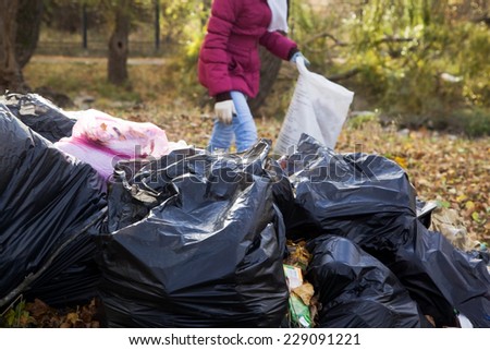 Girl activist raises trash in park cares about the environment