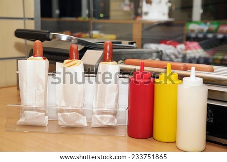 Plastic bottles with tasty sauces for of hot  hot dogs