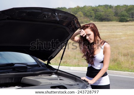 Young woman alone on a road grieved problem with the car