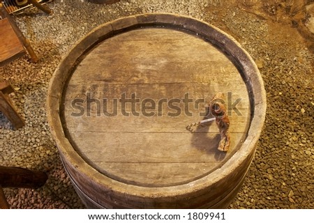 top view of a wood barrel with a bottle-opener on it
