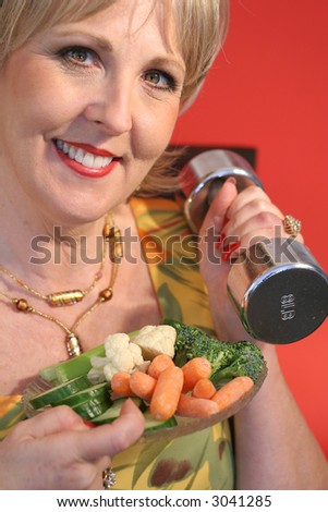 woman with fitness weights & healthy food upclose vertical