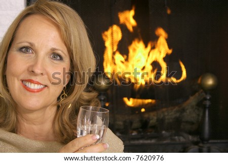 stunning woman in front of fireplace
