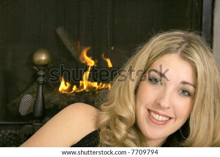 happy blonde by the fire