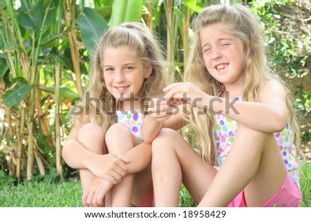 smiling twins outside
