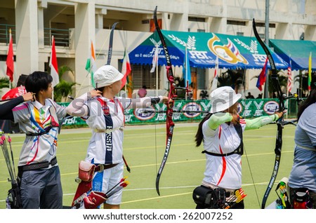 BANGKOK -MARCH 19: Unidentified archers in a row and shootin 2015 Asia Cup-World Ranking Tournament (stage II) at Hua Mak Sports Complex on March 19, 2015 in Bangkok, Thailand.