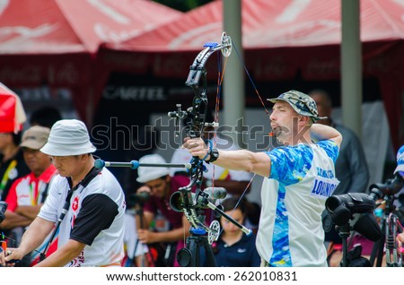 BANGKOK -MARCH 19: Unidentified archers in a row and shootin 2015 Asia Cup-World Ranking Tournament (stage II) at Hua Mak Sports Complex on March 19, 2015 in Bangkok, Thailand.
