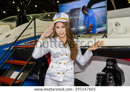 NONTHABURI - JUNE 24 : Unidentified model with boat on display at Bangkok International Auto Salon 2015 is Asean\'s biggest and most Exciting Modified Car Show on June 24, 2015 in Nonthaburi, Thailand.