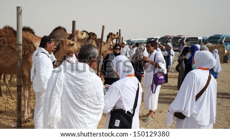 MECCA, SAUDI ARABIA - MAY 23:  Muslims pilgrims visit camel farm. Usually touring agency will include camel farm as a place to visit. May 23, 2013 in Mecca.