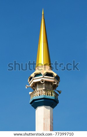 Muslim mosque tower isolated with blue sky at the background