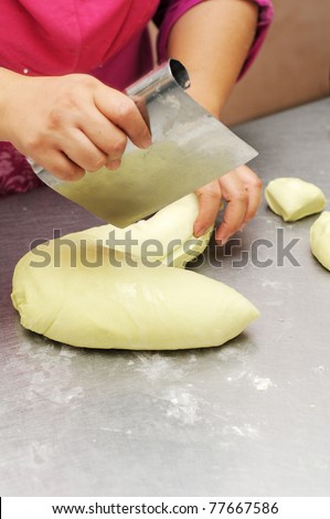 Hand cut dough to pieces with