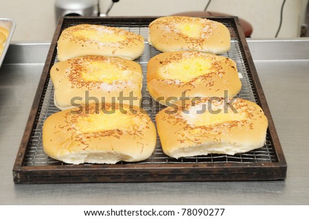 Baked bread on cooling tray on kitchen table