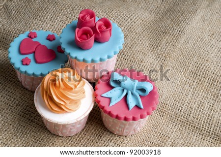 Colorfull cup cake in stack on canvas