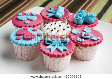 Close up colorfull cup cake on white plate