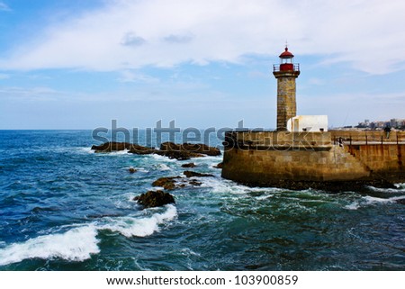 Lighthouse On A Pier On The Atlantic Ocean Coast In Porto, Portugal