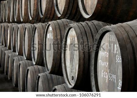 PORTO, PORTUGAL - MAY 20: rows of barrels with aging tawny port wine in Offley cellar on May 20, 2012 in Villa Nova de Gaia, Portugal. Offley is one of the oldest Port Houses in the Douro region.