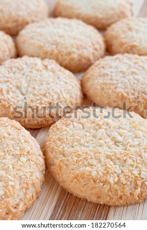 round cookies with coconut hips on top