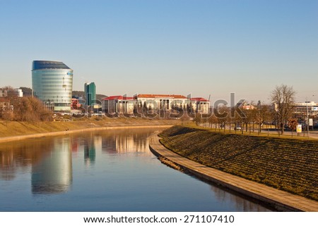 Vilnius, Lithuania - March 16, 2015: Lithuanian University of Educational Sciences and a modern building of Barclays bank near the Neris river in Vilnius.